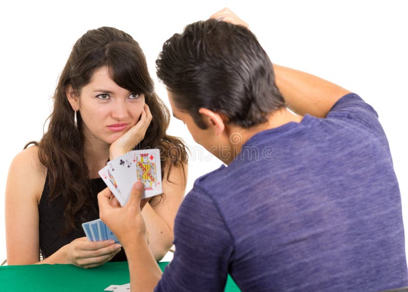 Young couple playing cards cuarenta