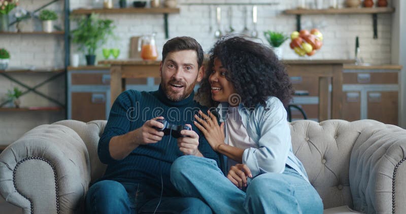 Premium Photo  Girlfriend supports her pro gamer boyfriend, playing online  video game using streaming professional equipment