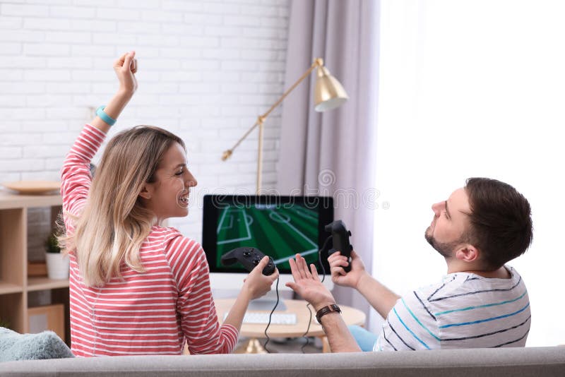 Young couple playing video game