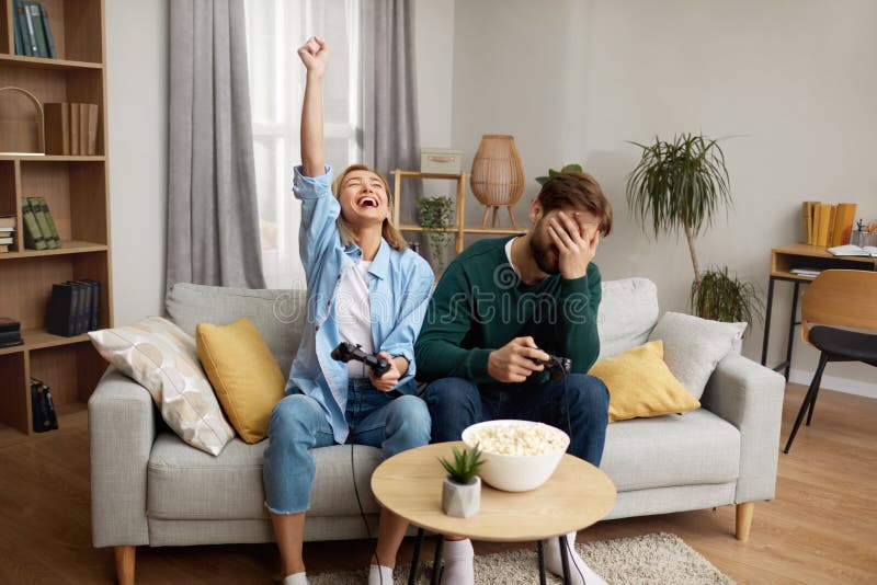 Premium Photo  Pov of young couple using console to play videogames  challenge, doing online competition on cyberspace. focused boyfriend and girlfriend  playing together to do fun leisure activity.