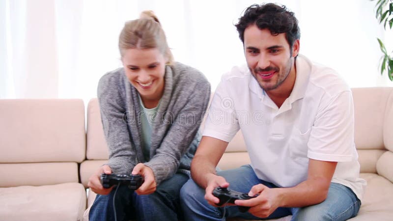 Young couple playing video games