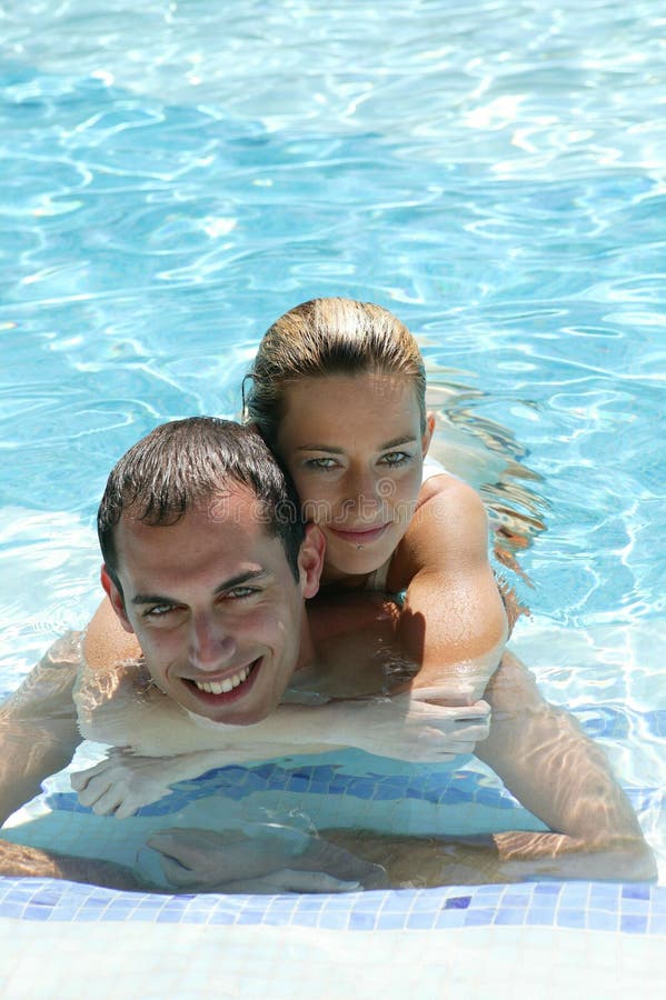 Young couple in the pool