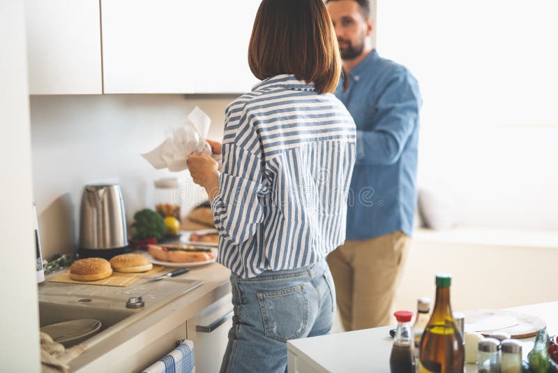 Young couple preparing for romantic dinner in kitchen stock images Young couple preparing for romantic dinner in kitchen stock images
