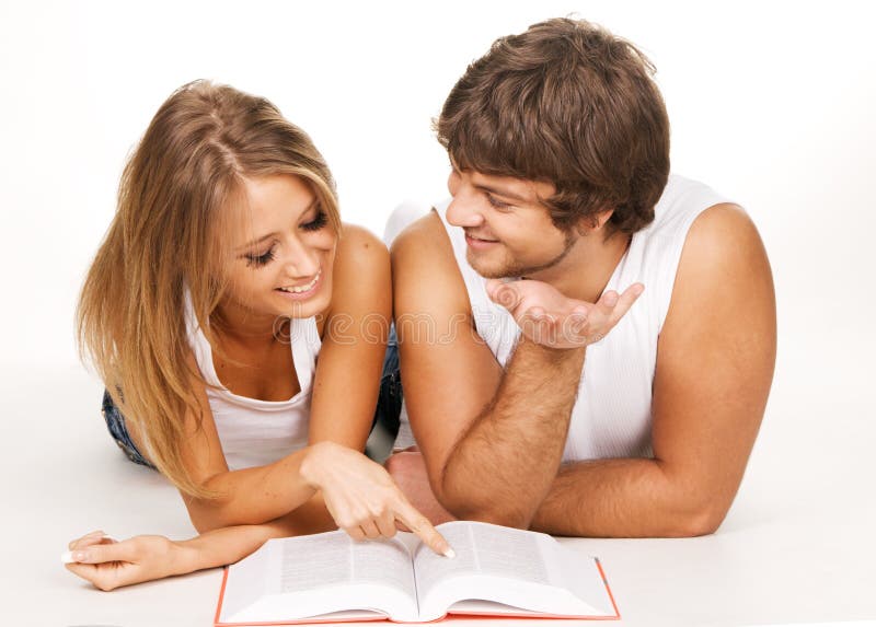 Young couple reading a book