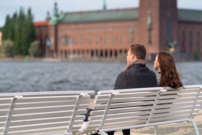 Young couple relaxing overlooking the water