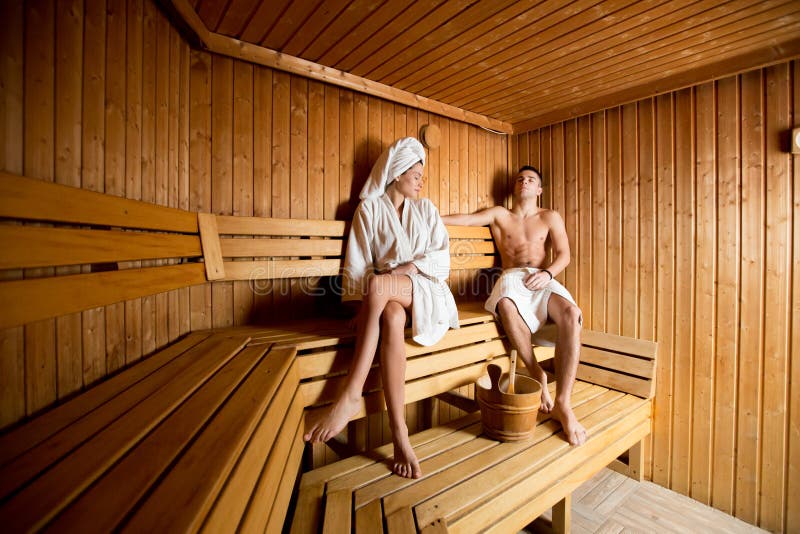Young couple in the sauna stock image. Image of chat 50856347