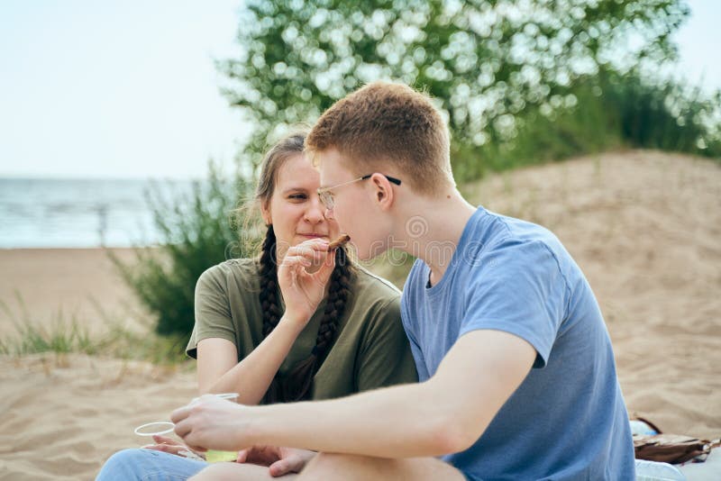 The boy looks tenderly at girl and wants to kiss. Concept of teenage love  and first kiss 7542624 Stock Photo at Vecteezy