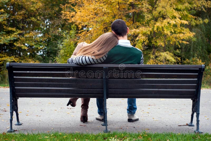 Love Couple Sitting on Bench by the Sea Embracing Stock Image Image