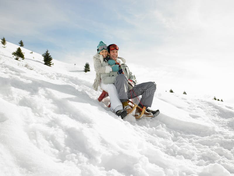 Young Couple Sledding