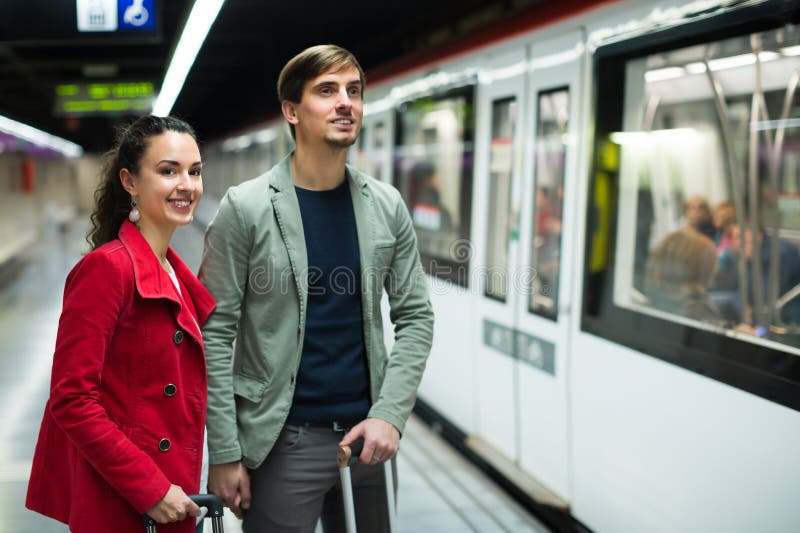 Young Couple Standing At Underground Station