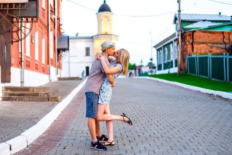 Young couple summer day in the city kiss with love concept family event, the relationship. Lifestyle in the hap royalty free stock photography Young couple summer day in the city kiss with love concept family event, the relationship. Lifestyle in the hap royalty free stock photography