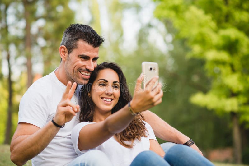 Young Couple Taking A Selfie Photo At Park Stock Image Image Of