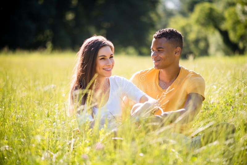 Grassfield date - couple together in nature