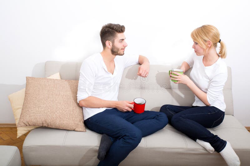 Young couple talking on the Sofa