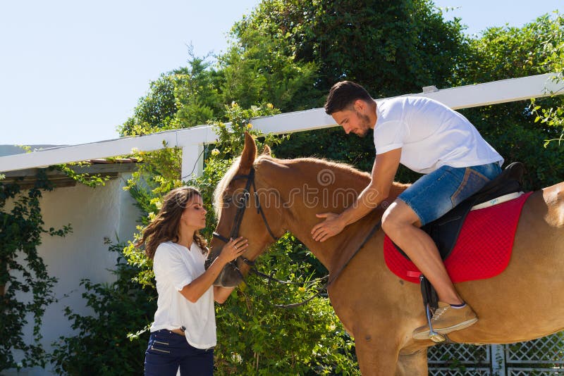 Young Couple And Their Brownblond Horse Stock Photo Image Of Beauty