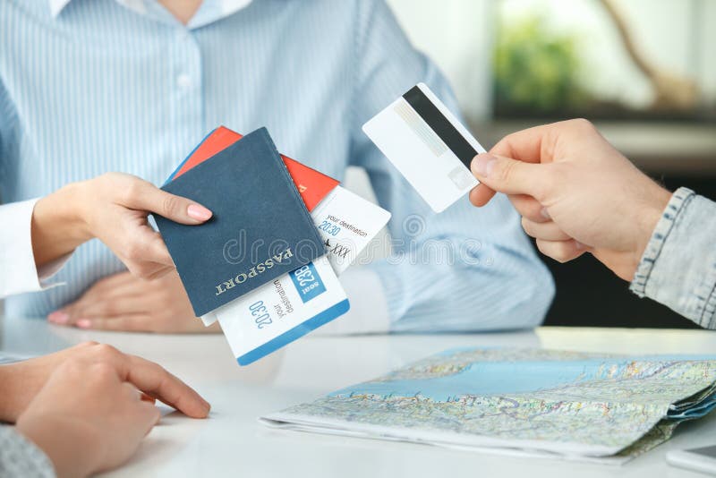 Young Couple in a Tour Agency Communication with a Travel Agent Travelling  Concept Credit Card Payment Close-up Stock Image - Image of agency,  assistant: 108544445
