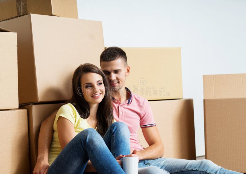 Young Couple Unboxing In Their New Home Stock Photo Image Of Happy