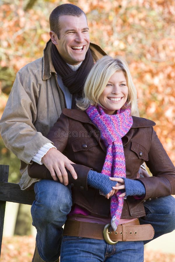 Young couple resting on autumn walk. Young couple resting on autumn walk