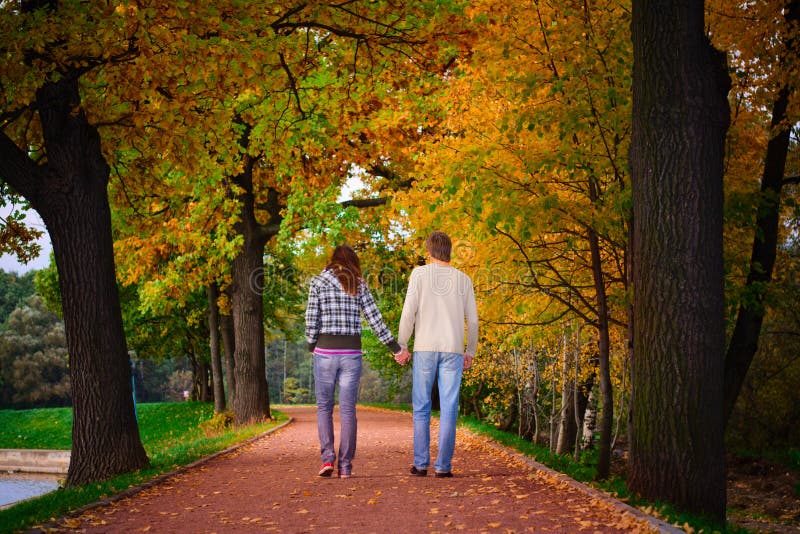 Young couple walking in the garden