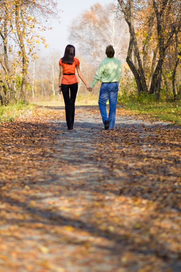 Young couple walking in the park