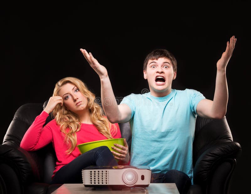 Young couple watching a movie stock image Young couple watching a movie stock image