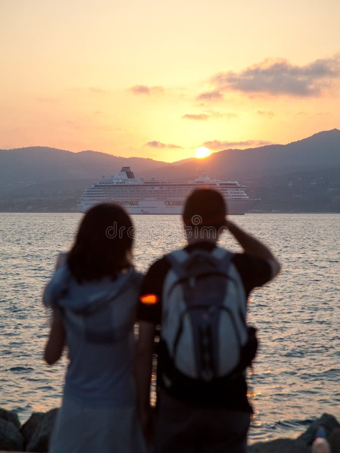 Young couple watching sunset