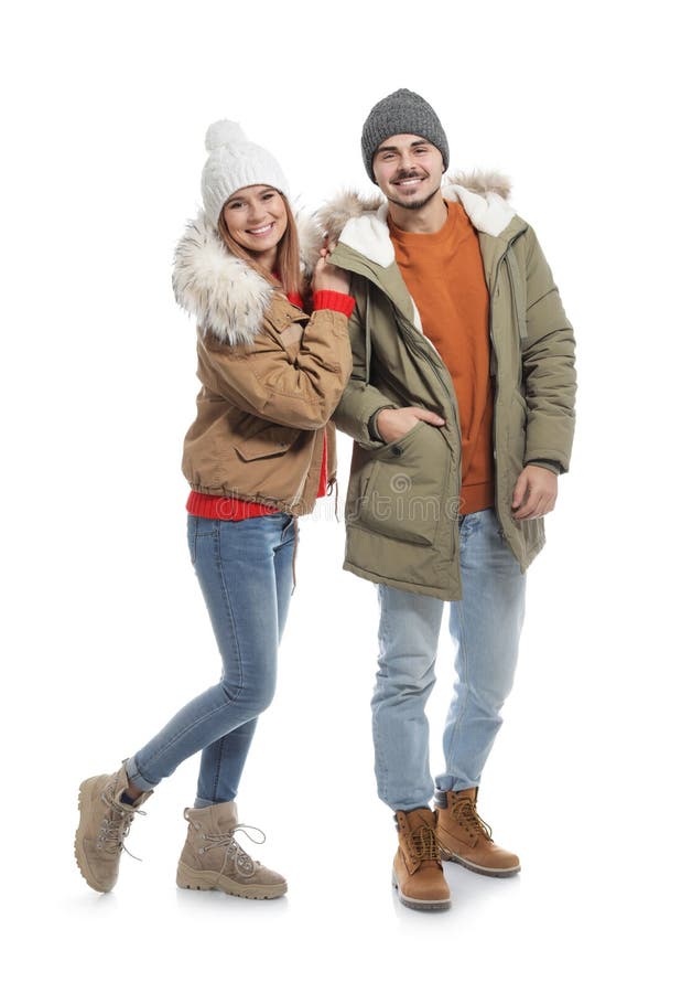 Young Couple Wearing Warm Clothes on White. Ready for Winter Vacation ...