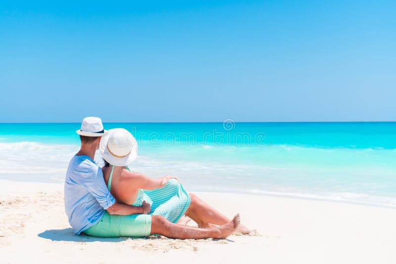 Young Couple On White Beach During Summer Vacation Happy Lovers Enjoy Their Honeymoon Stock