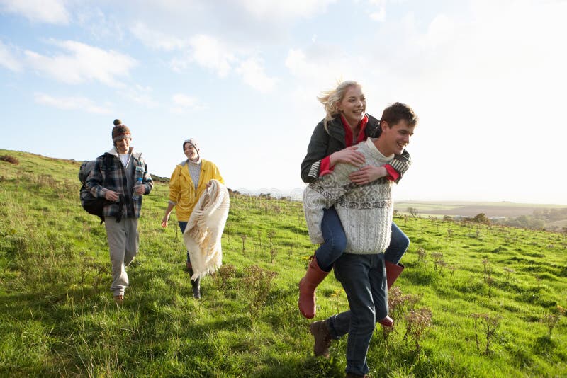 Young Couples On Country Walk Stock Photo - Image of horizontal