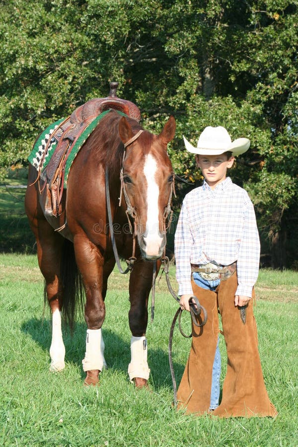 Young cowboy and horse stock photo. Image of clothing - 6740868