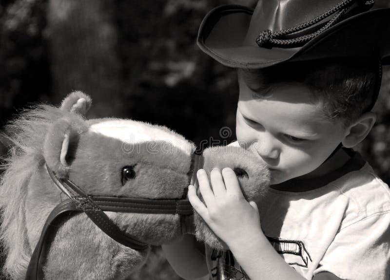 young-cowboy-kissing-his-horse-6225694.jpg
