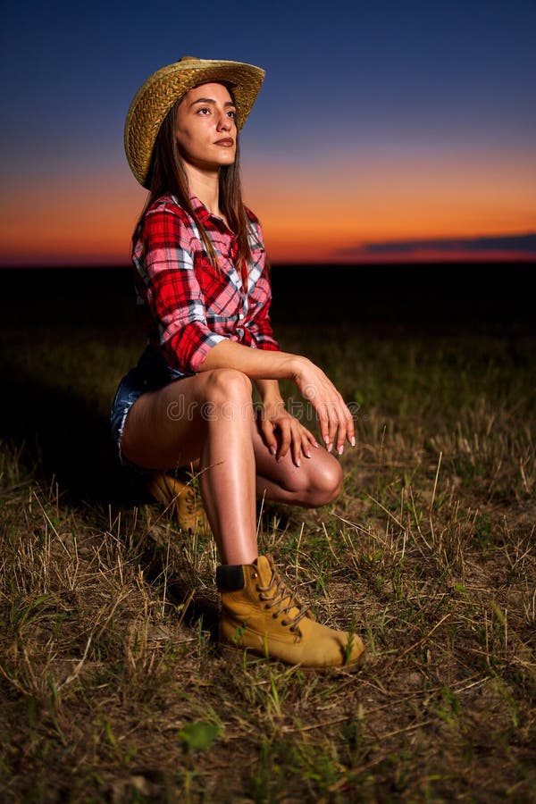 Young cowgirl at sunset stock image. Image of grain - 195486241