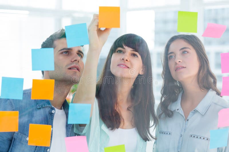Young creative business people writing photo editor stock images Young creative business people writing photo editor stock images