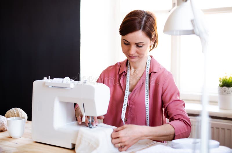 Young Creative Woman in a Studio, Working. a Startup of Tailoring ...