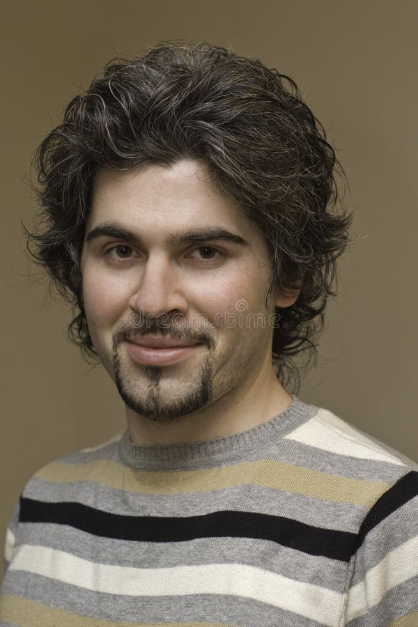 Young curly handsome man portrait