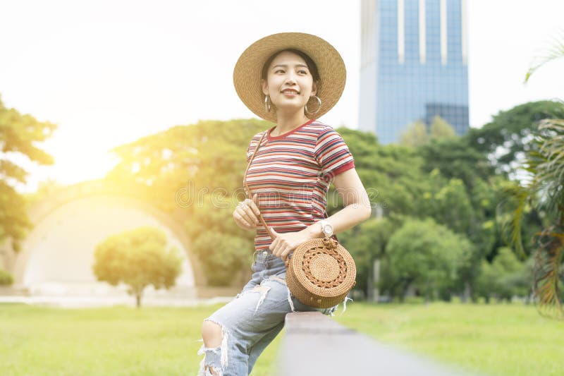 Young and cute Asian woman is enjoy lifestyle and travel into the Lumphini Park royalty free stock images Young and cute Asian woman is enjoy lifestyle and travel into the Lumphini Park royalty free stock images