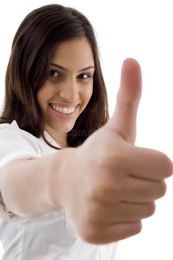 Young cute girl showing thumbs up