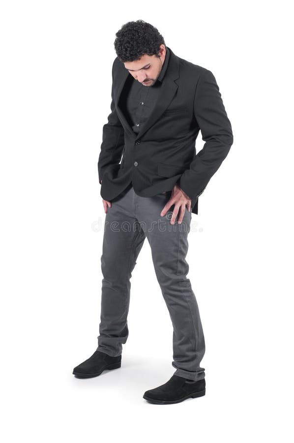 Young cute guy holding hands in pockets royalty free stock photo