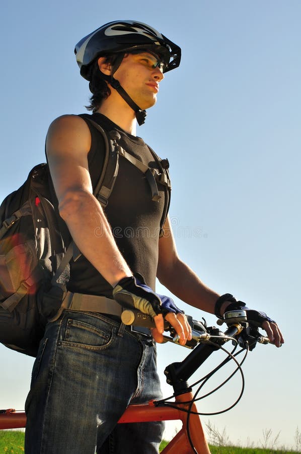 Young cyclist looking forward