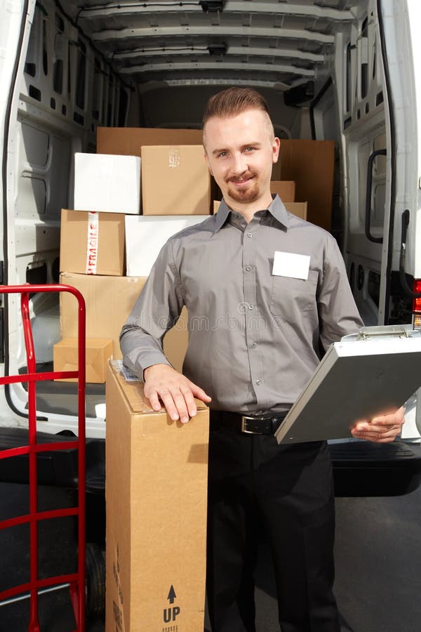 Young Delivery Man with a Parcel. Stock Image Image of business