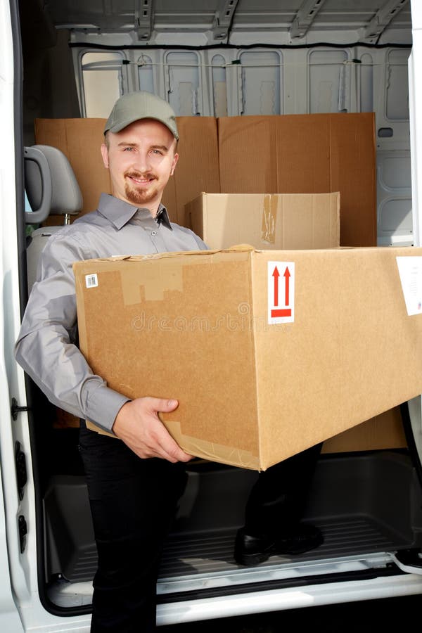 Young Delivery Man with a Parcel. Stock Image Image of business