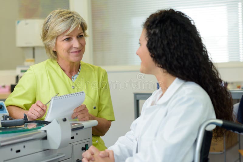 Young dentist in job interview at dental office stock photo