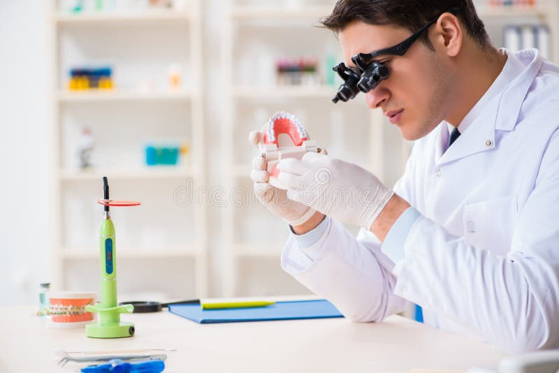 The young dentist working in the dentistry hospital stock photography The young dentist working in the dentistry hospital stock photography