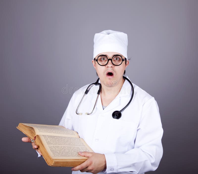 Young doctor with book.