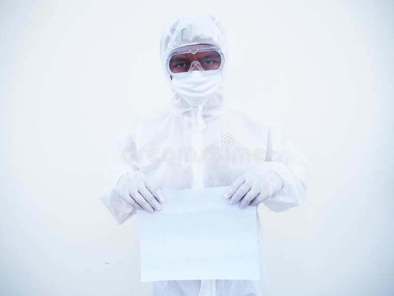 Young doctor or scientist in PPE suite uniform holding blank paper for text with both hands While looking ahead. coronavirus or stock photos