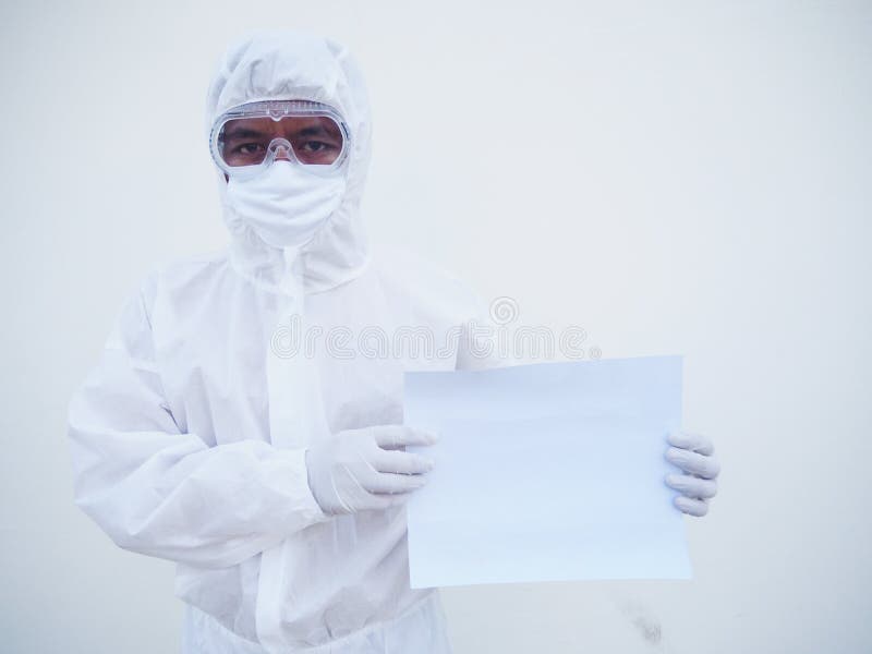 Young doctor or scientist in PPE suite uniform holding blank paper for text with both hands While looking ahead. coronavirus or royalty free stock photography
