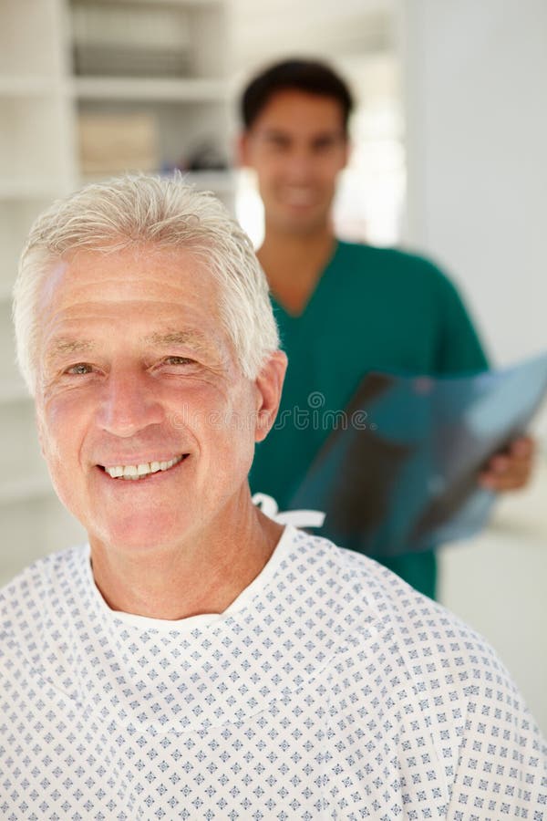 Young doctor with senior patient royalty free stock images