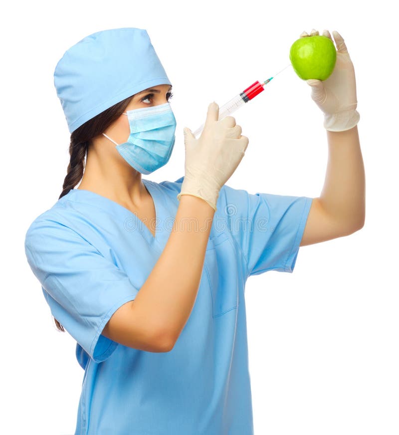 Young doctor with syringe and apple