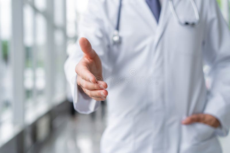 Young Doctor Welcoming At His Office Medical Doctor Man Smile Hold