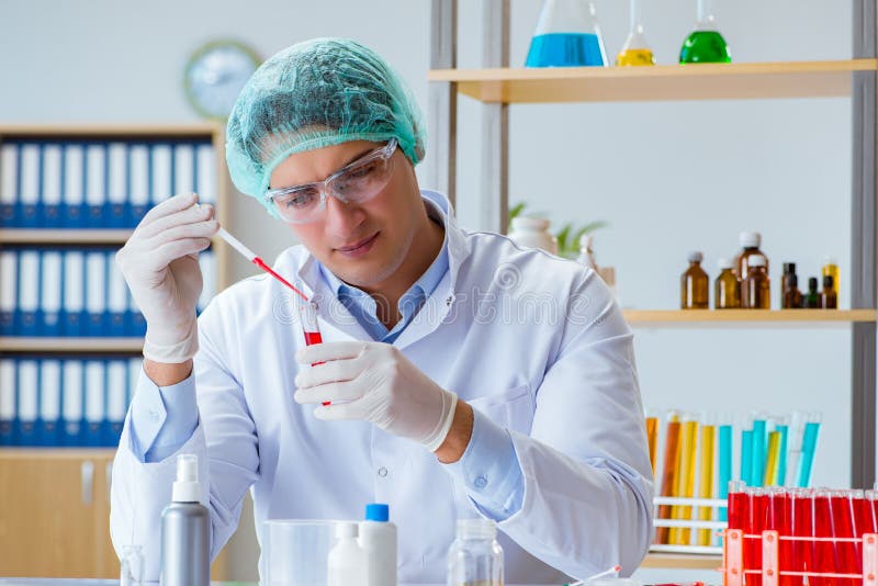 The Young Doctor Working on Blood Test in Lab Hospital Stock Image